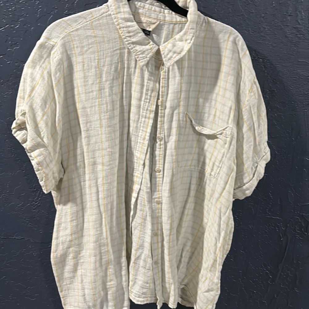 Button down striped shirt with pocket on front.